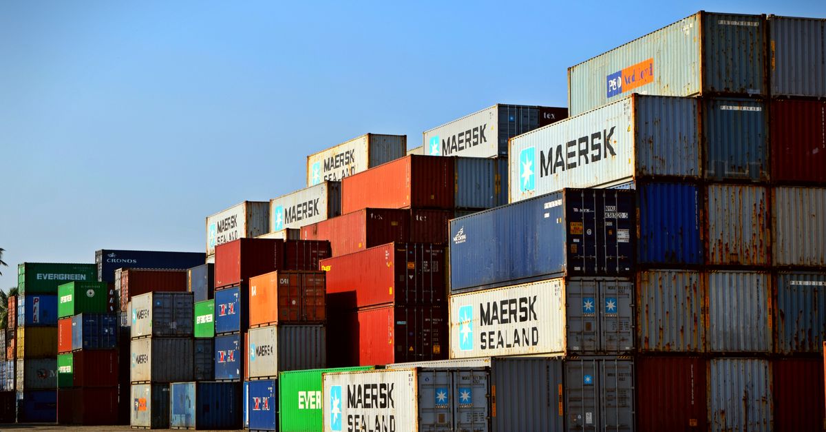 Colourful shipping containers stacked at a port